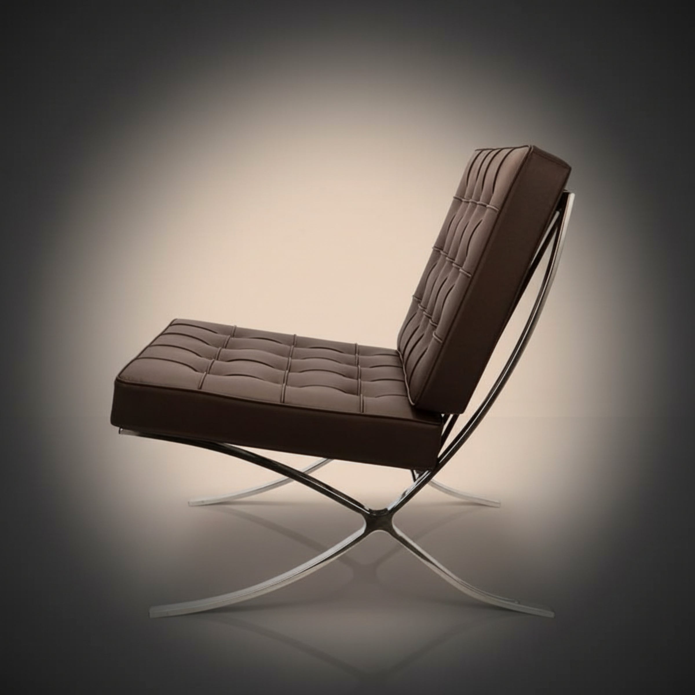 A modern brown tufted leather lounge chair with a chrome X-frame base, shown from a three-quarters angle.