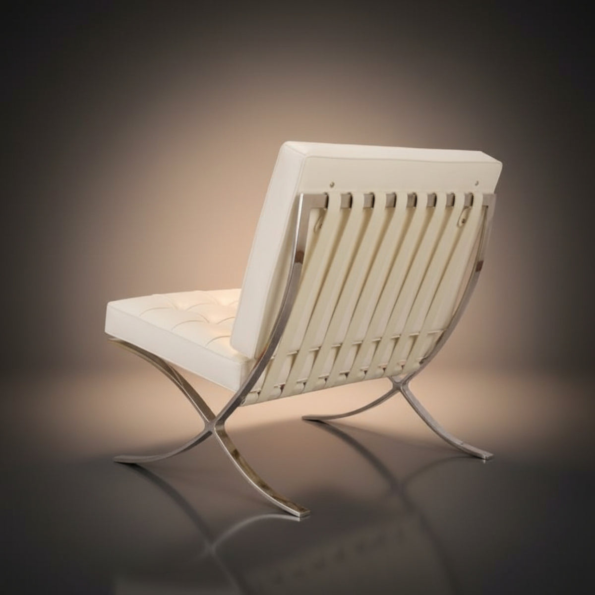 A modern lounge chair with a white tufted seat and backrest, featuring vertical chrome slats and an X-shaped chrome base.
