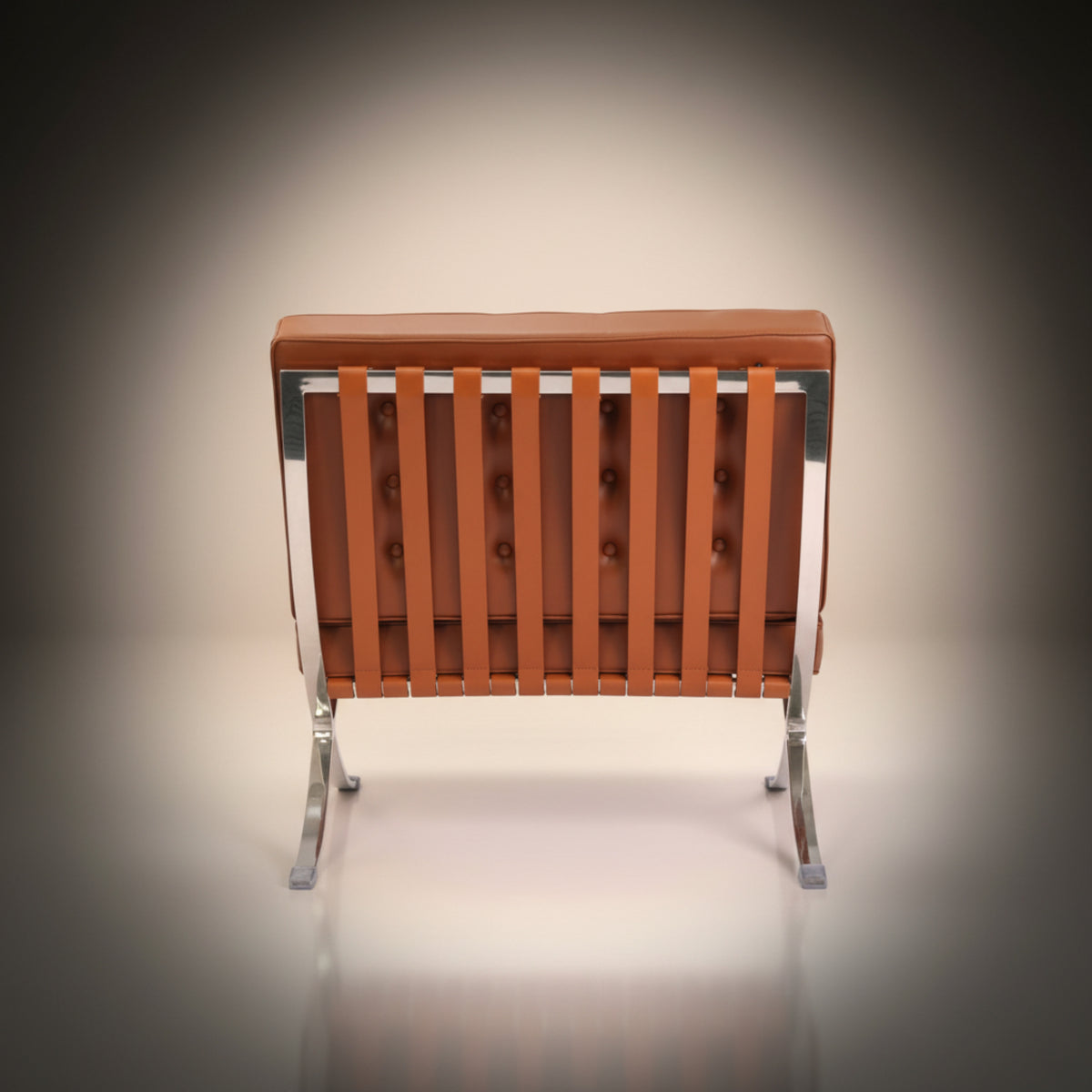 A modern lounge chair with a tufted brown leather backrest, vertical leather seat slats, and a chrome metal frame