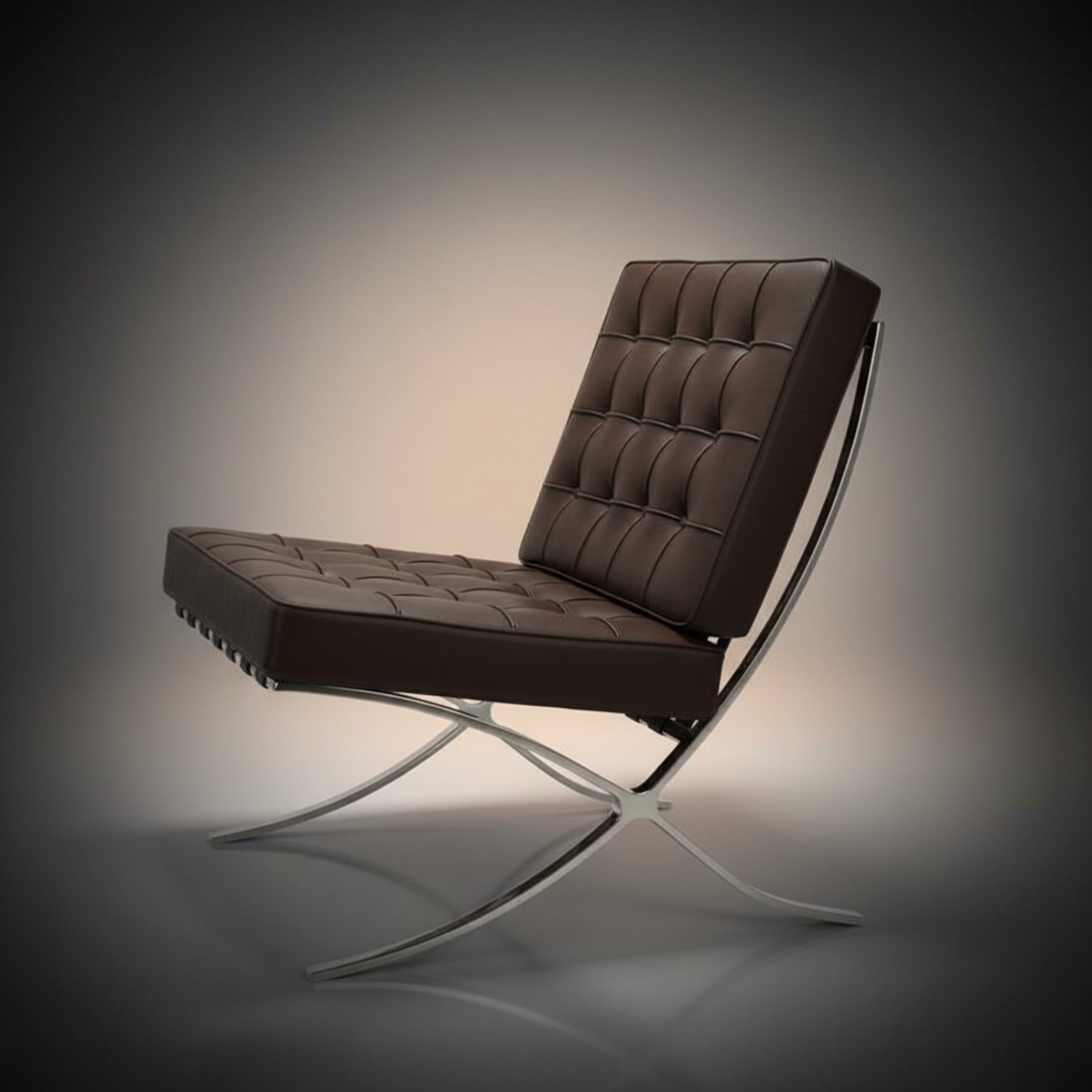 A modern brown leather lounge chair with a tufted backrest and seat, supported by a curved chrome metal base