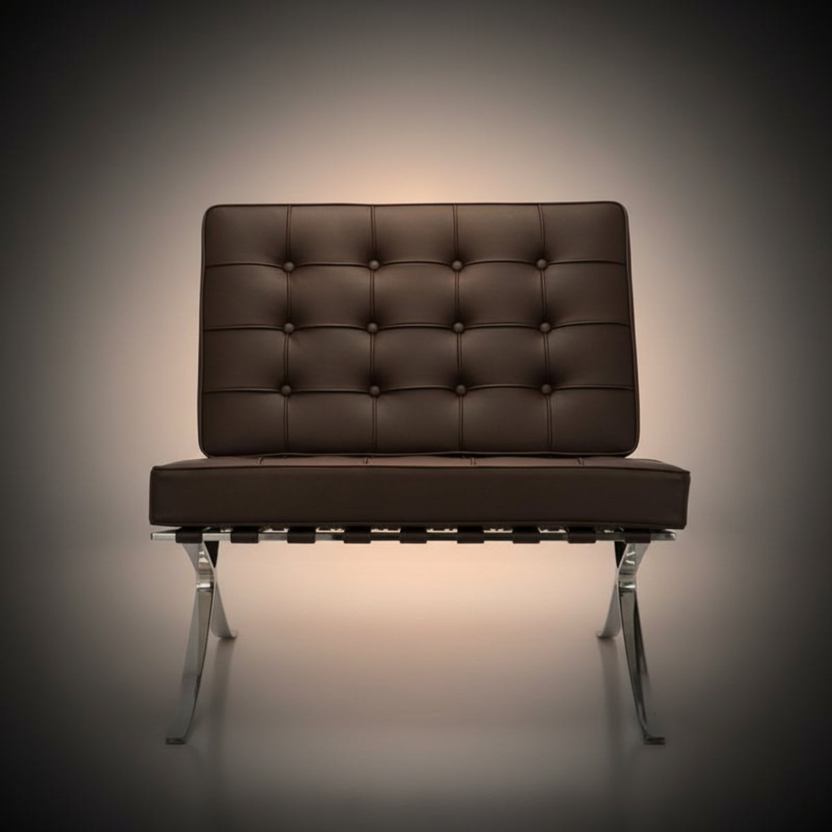 A modern tufted leather armchair with a brown cushioned backrest and seat, supported by a chrome metal base