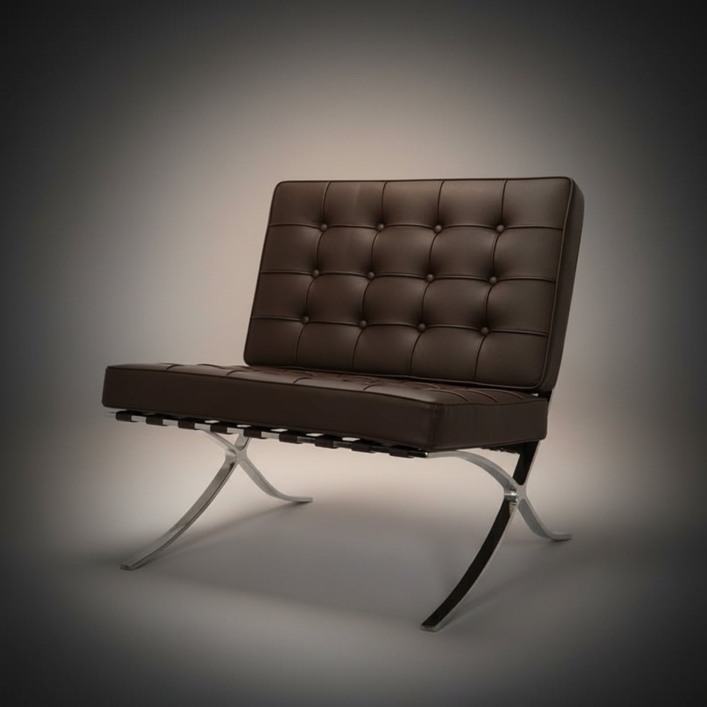 A modern armchair with a tufted brown leather seat and backrest, supported by a chrome.