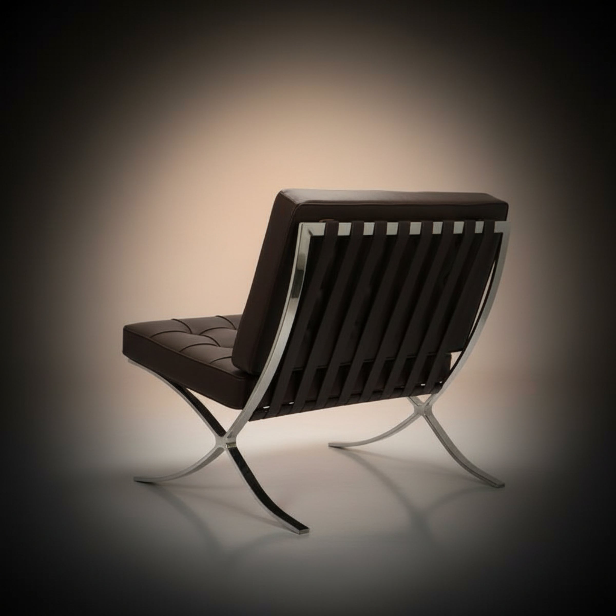 A modern leather and metal lounge chair shown from the back, featuring a dark brown tufted seat and backrest with a chrome.