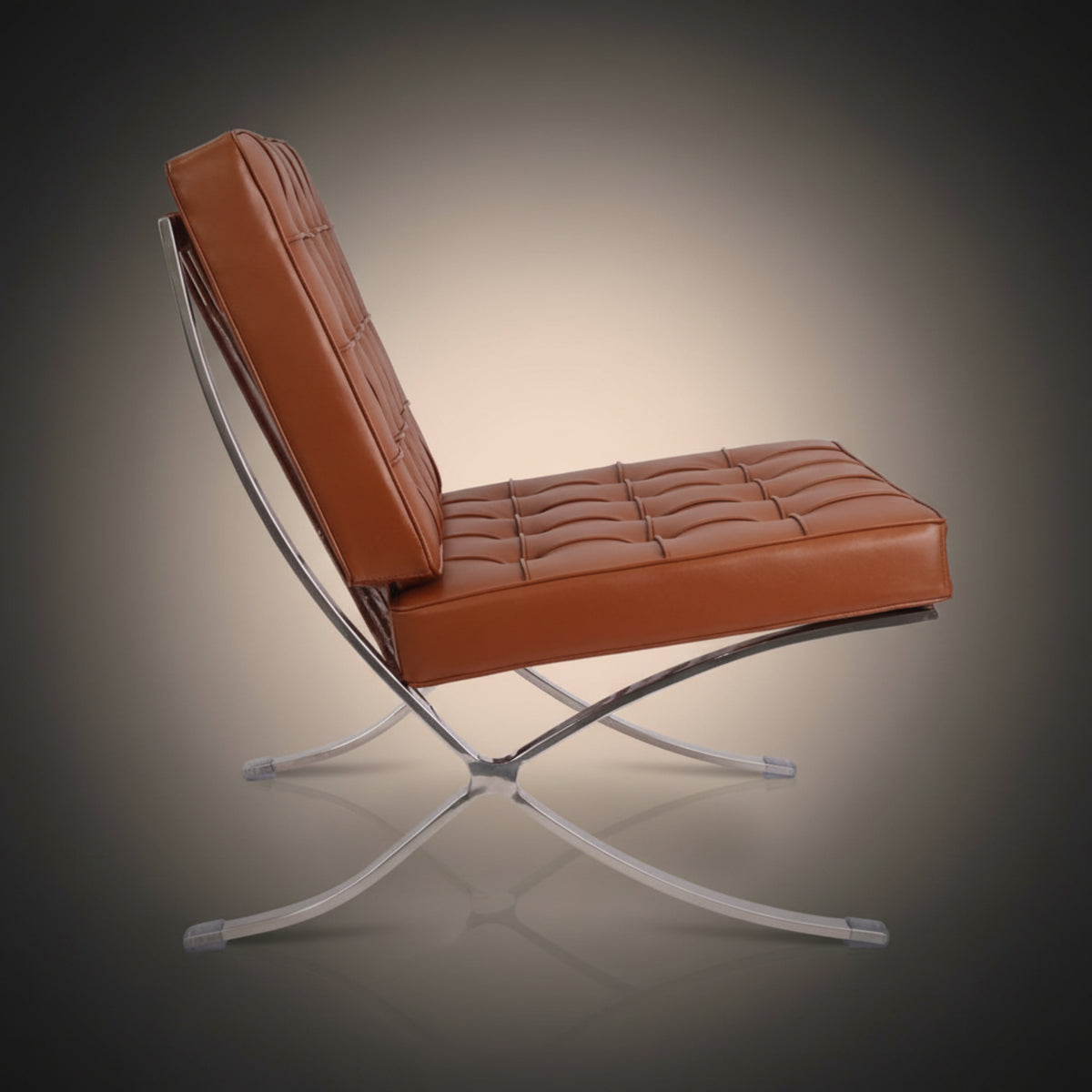 A modern Barcelona replica accent chair with tufted cognac brown leather upholstery and a chrome base.