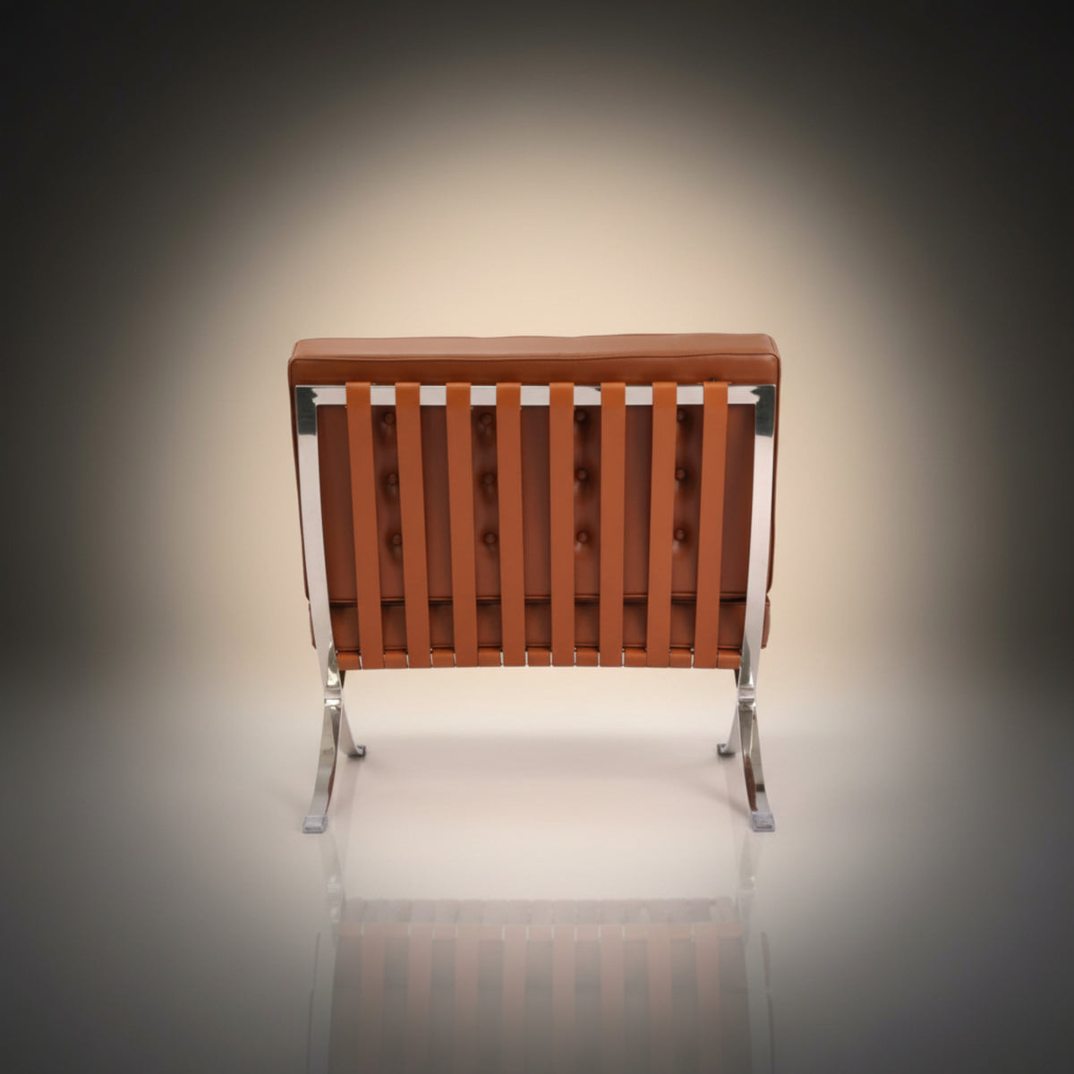 A modern armless lounge chair with a tufted brown leather backrest and backrest frame, supported by a chrome steel frame.