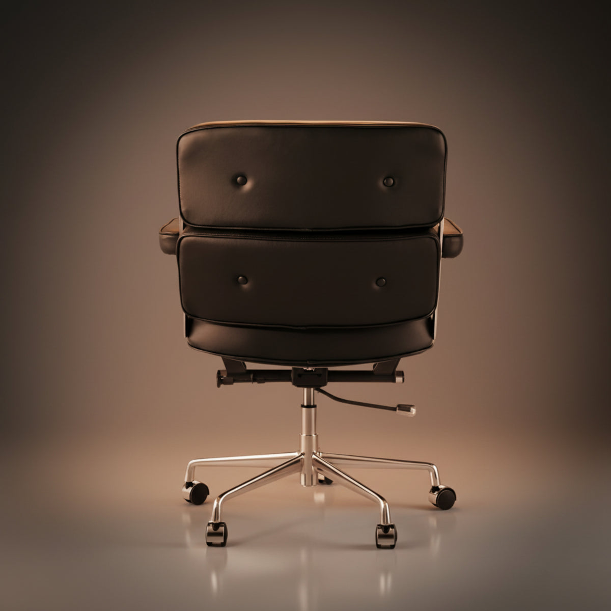 A black leather office chair with a stacked two-seat cushion, tufted button details, and a chrome five-star wheeled base.
