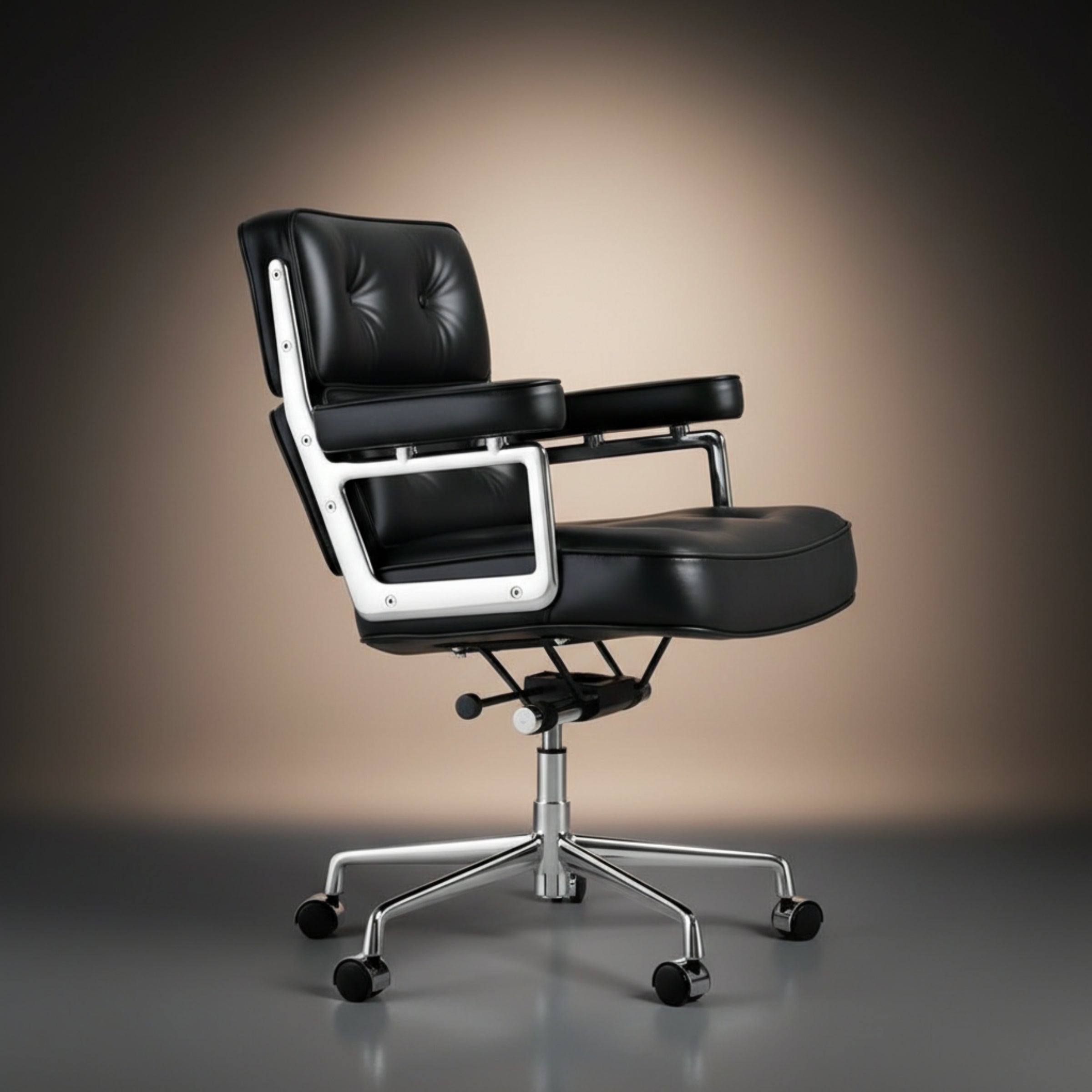 A modern black leather office chair with a tufted backrest, padded armrests, and a chrome five-star wheeled base.