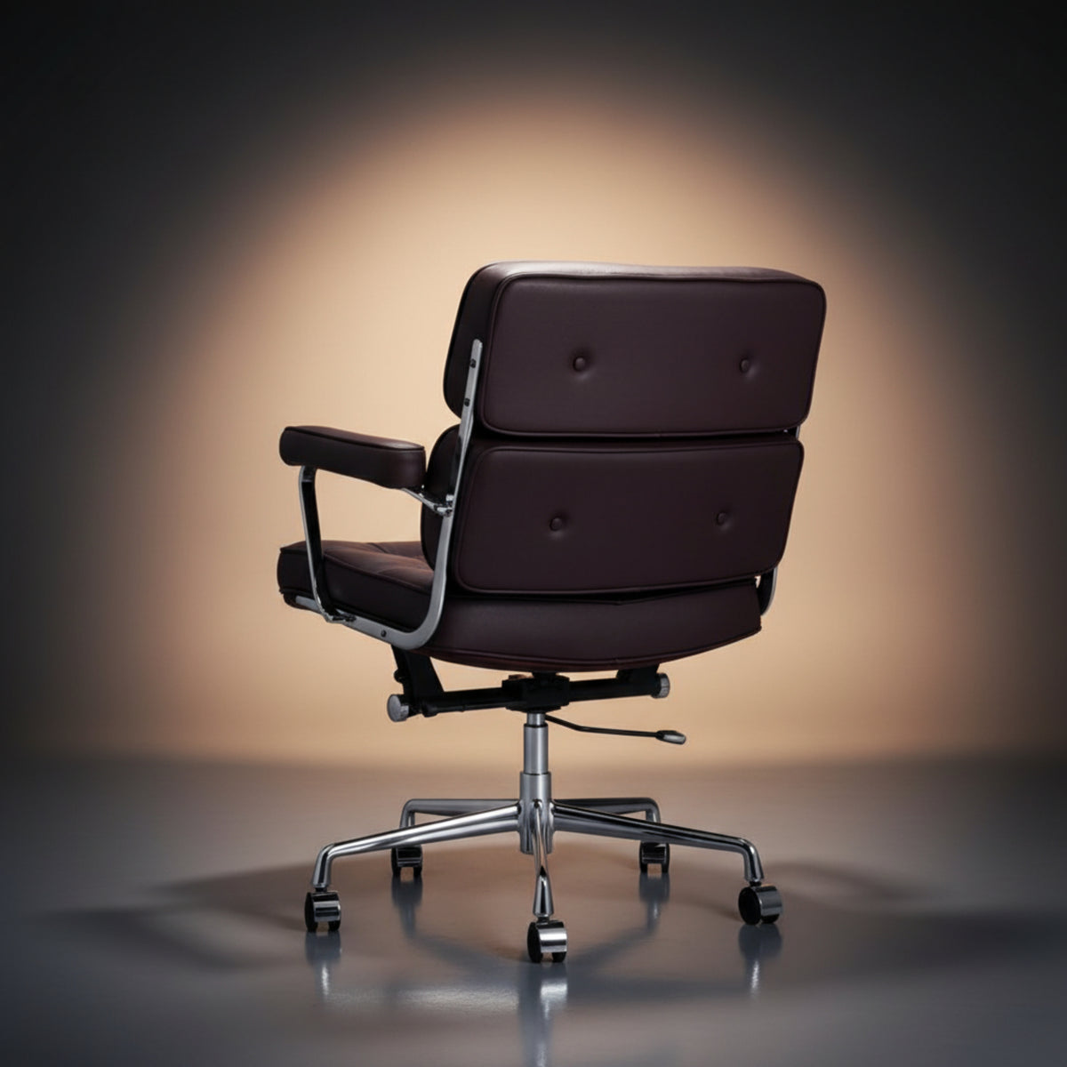 A modern office chair with deep burgundy-brown leather upholstery and a polished chrome five-star base.