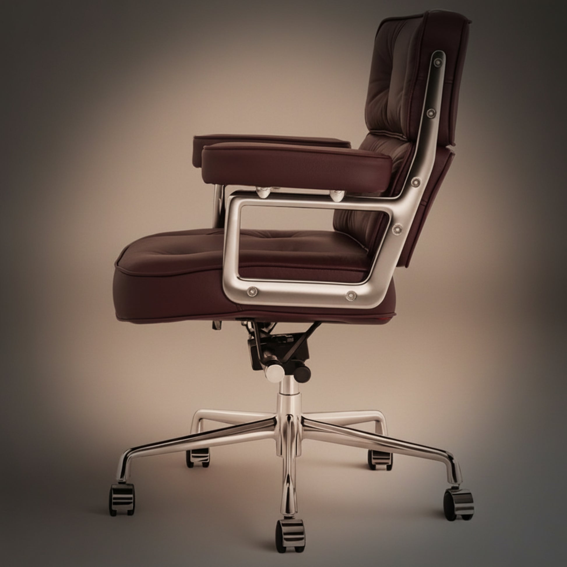A modern office chair with a deep burgundy-brown leather seat and back, supported by a polished silver metal frame.