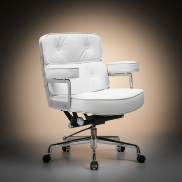 A modern white upholstered office chair with tufted back and seat cushions, chrome metal arm supports, a black gas-lift mechanism.