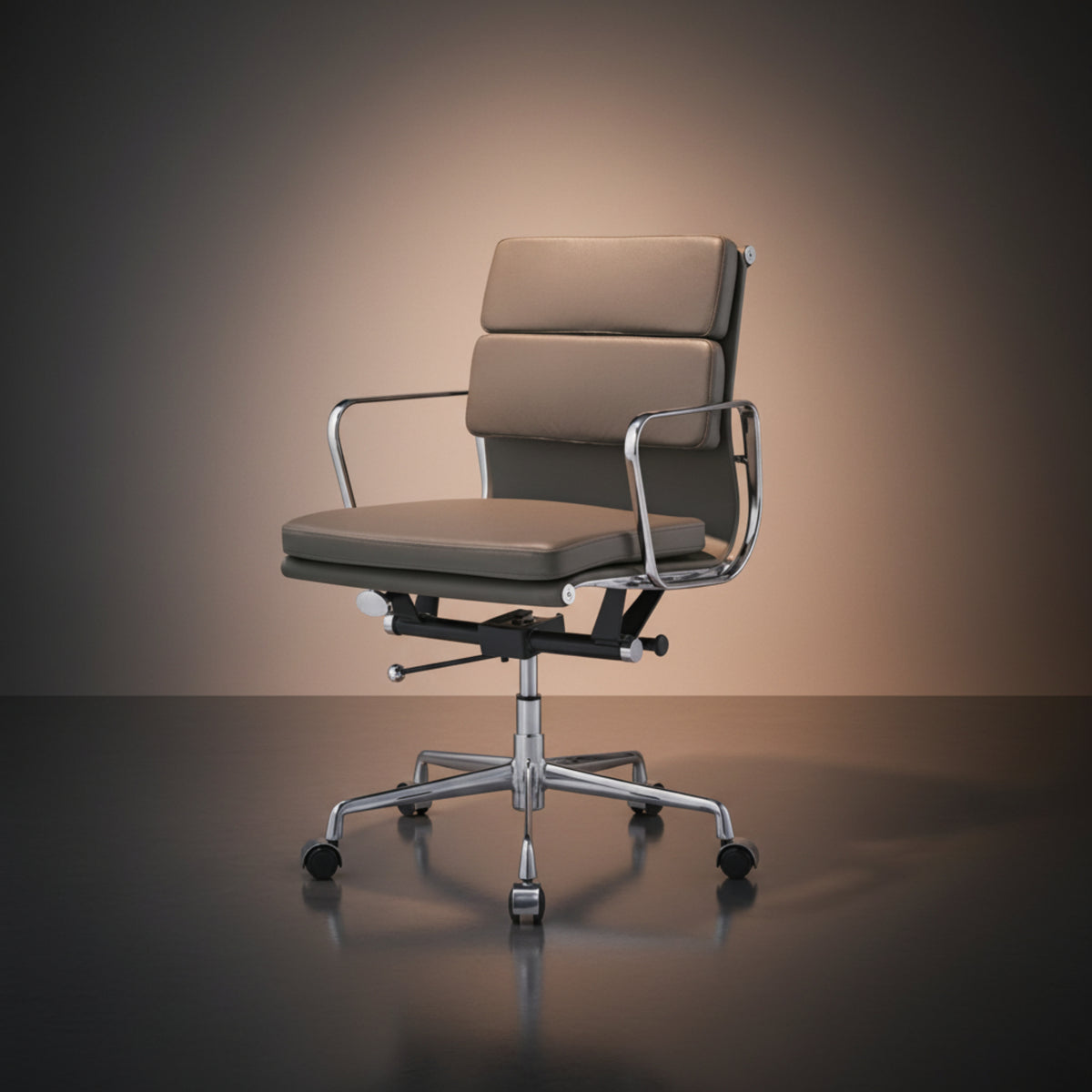 A modern office chair with a padded taupe seat and backrest, supported by a chrome five-star base with casters.