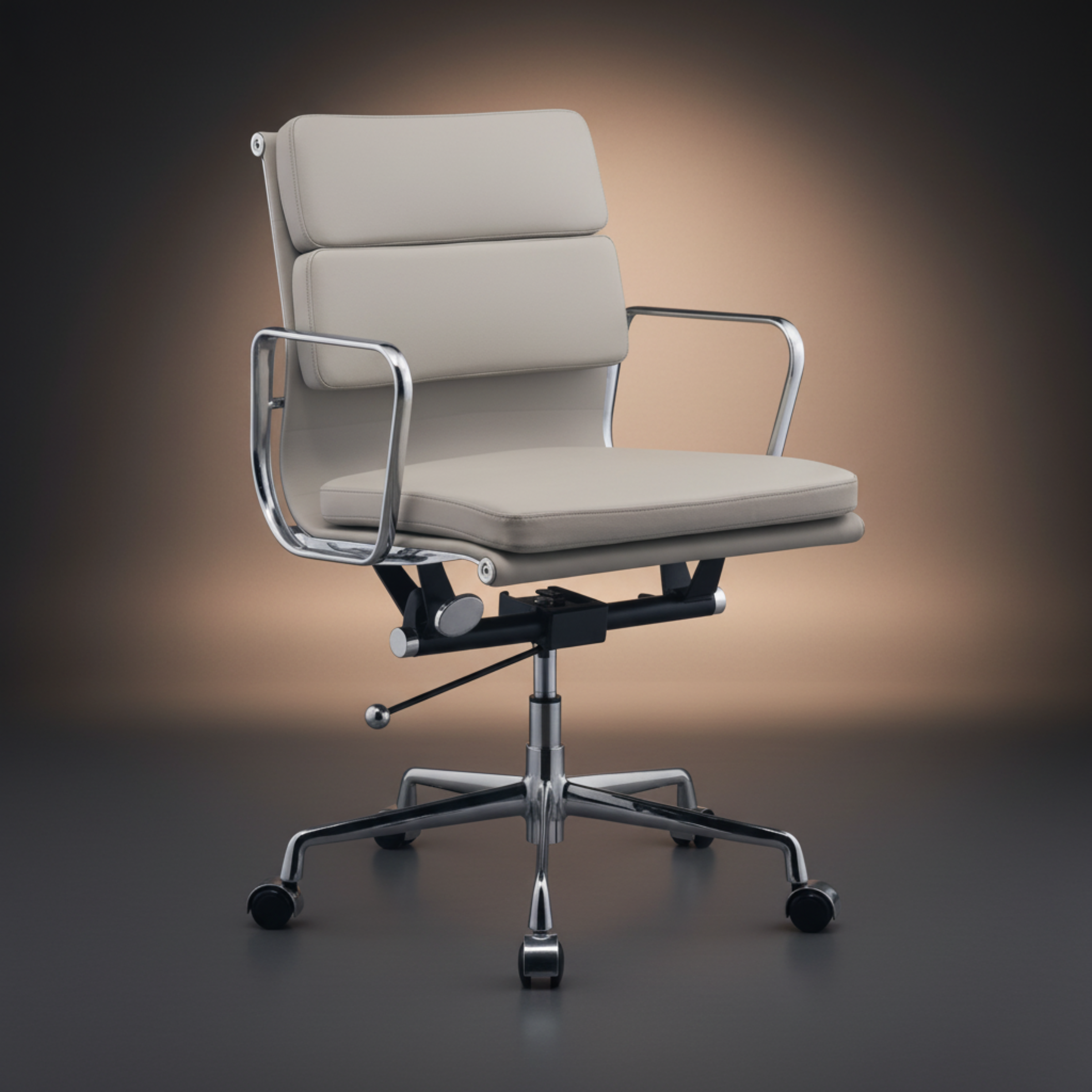 A modern office chair with cream-colored padded upholstery and a polished chrome five-star base.
