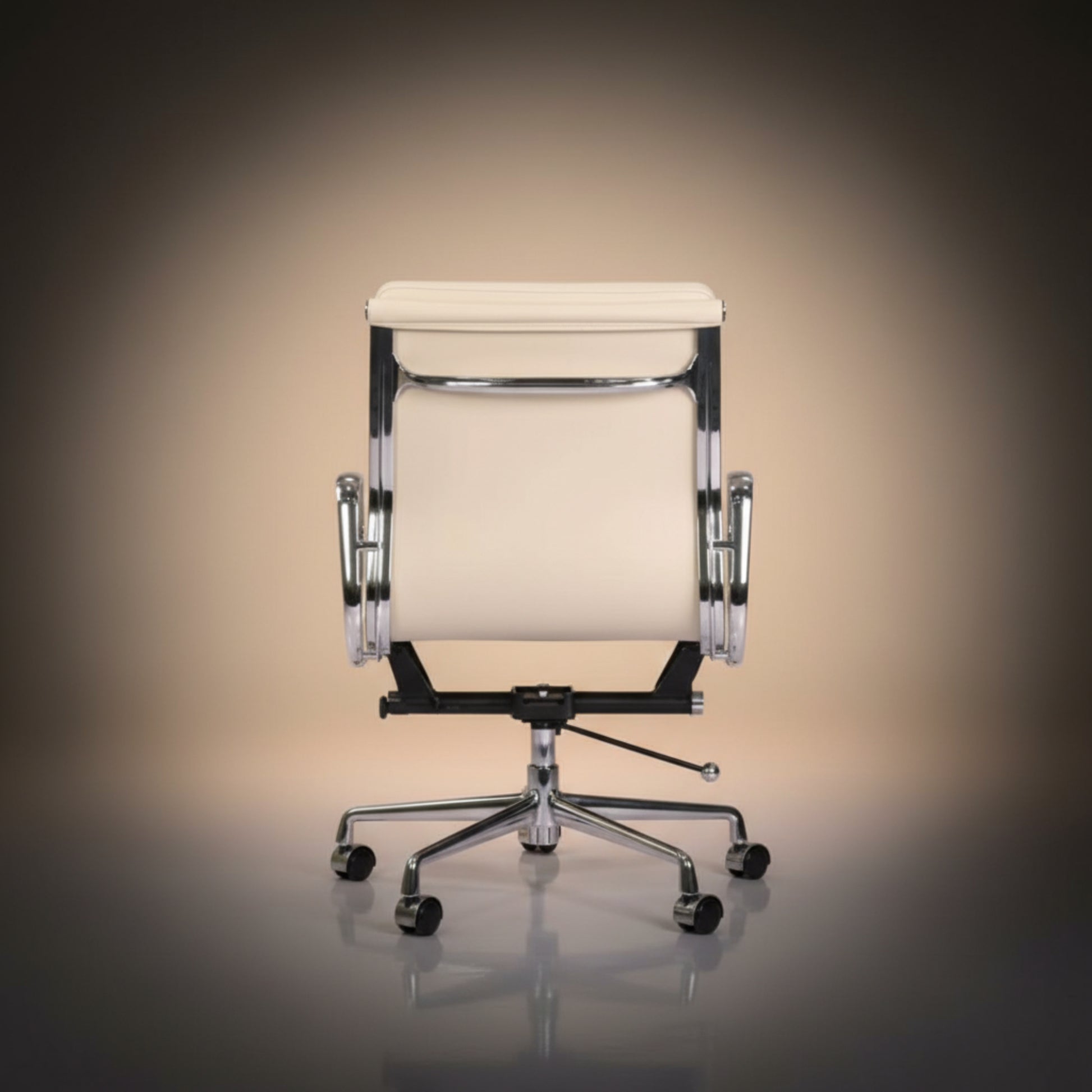 A modern office chair with a cream-colored upholstered seat and backrest, supported by a chrome base.