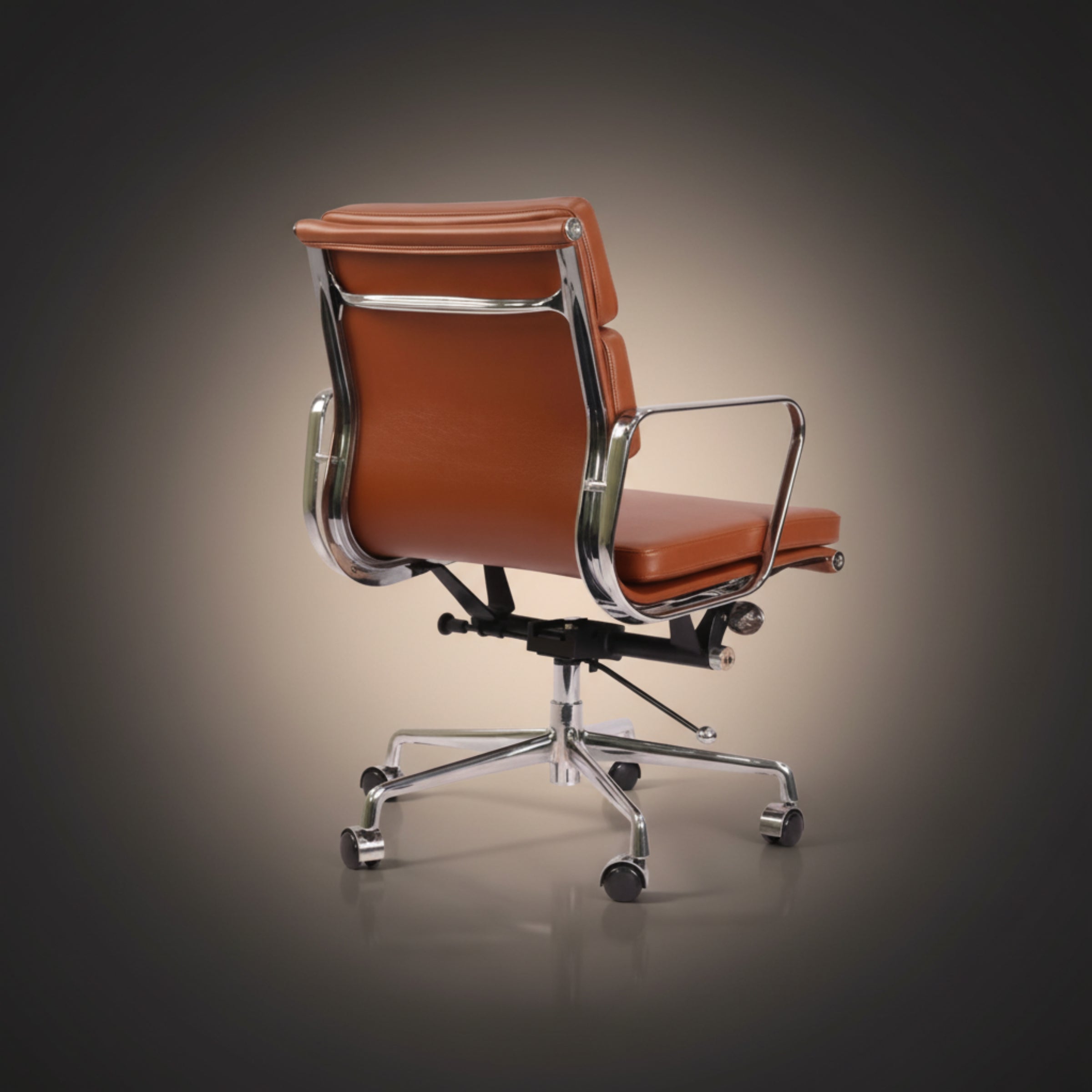 A modern office chair with brown leather upholstery and polished chrome metal frame and base.