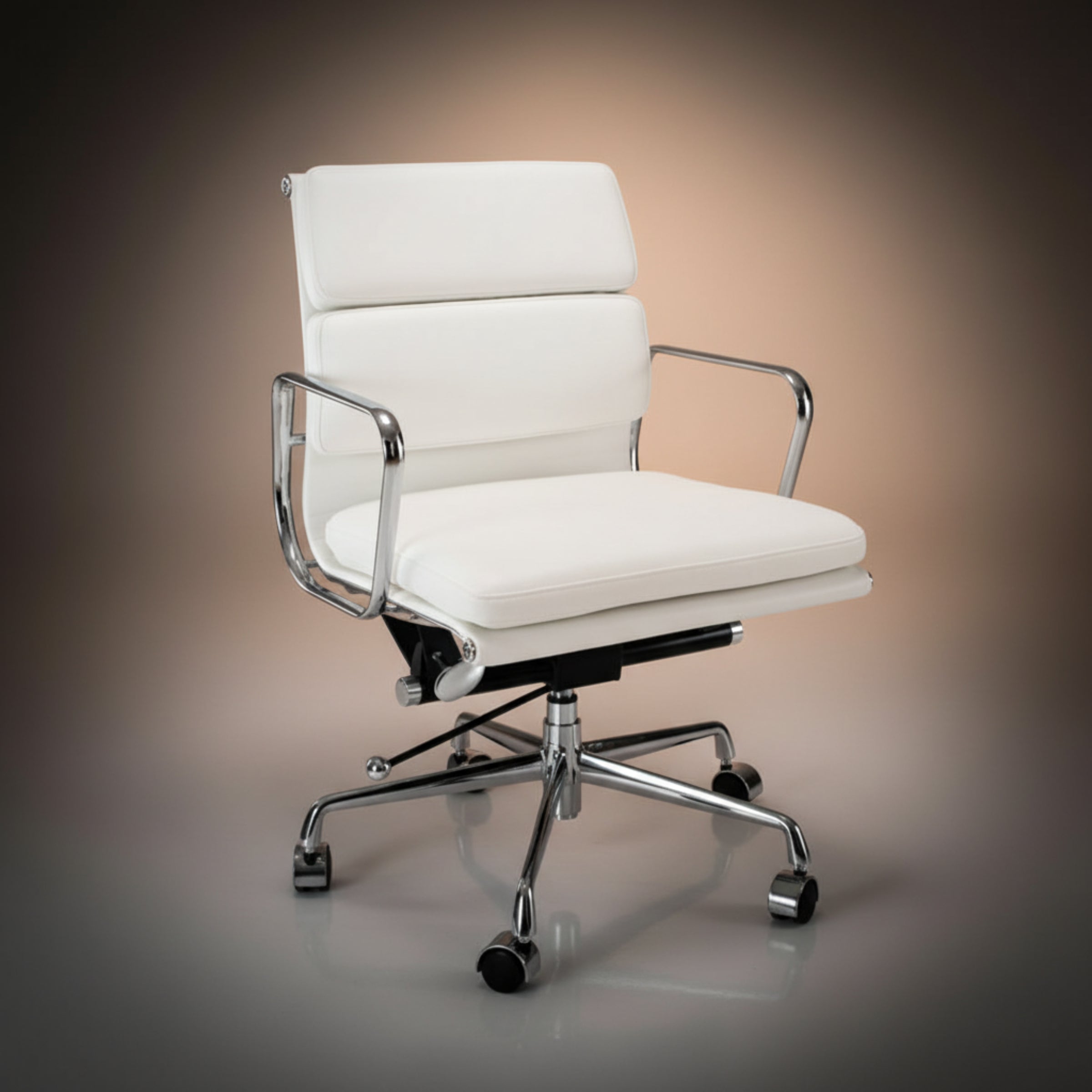 A modern white leather office chair with a chrome five-star base and casters, shown against a dark brown gradient studio background.