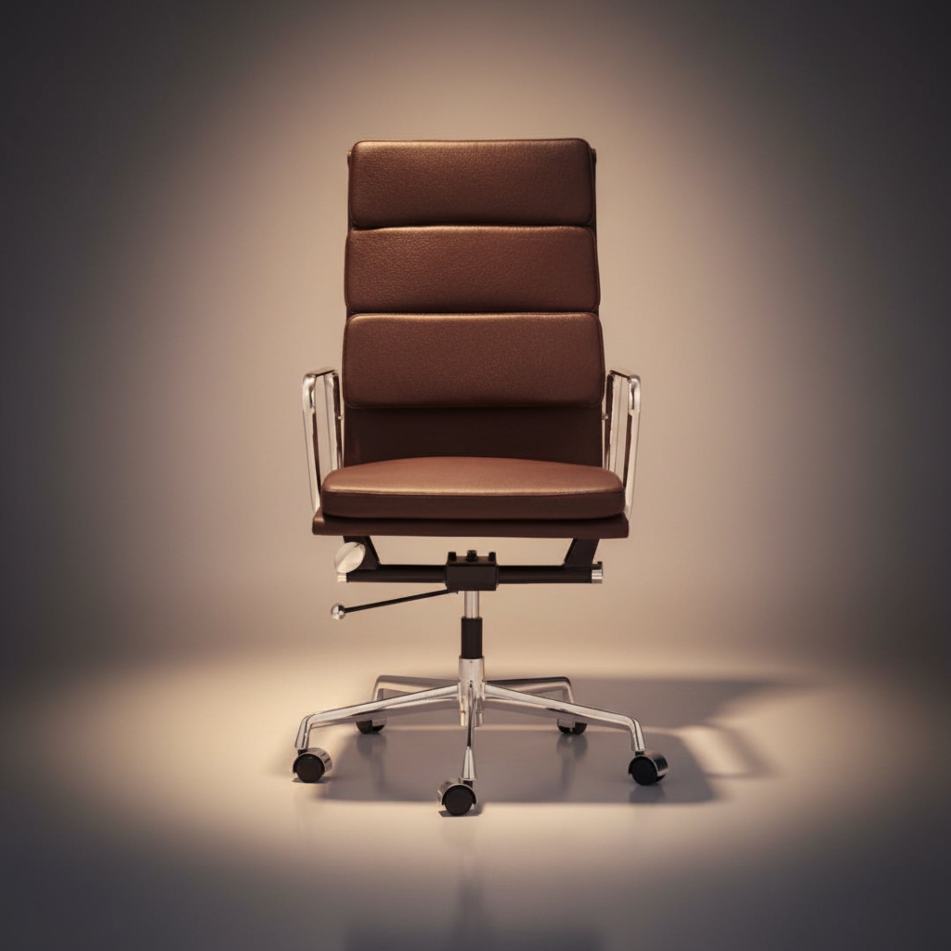 A modern high-back office chair with brown padded upholstery and a chrome five-star base.