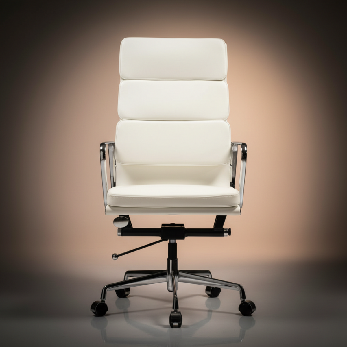 A modern high-back office chair upholstered in white leather or faux leather, featuring a segmented backrest, chrome metal armrests.