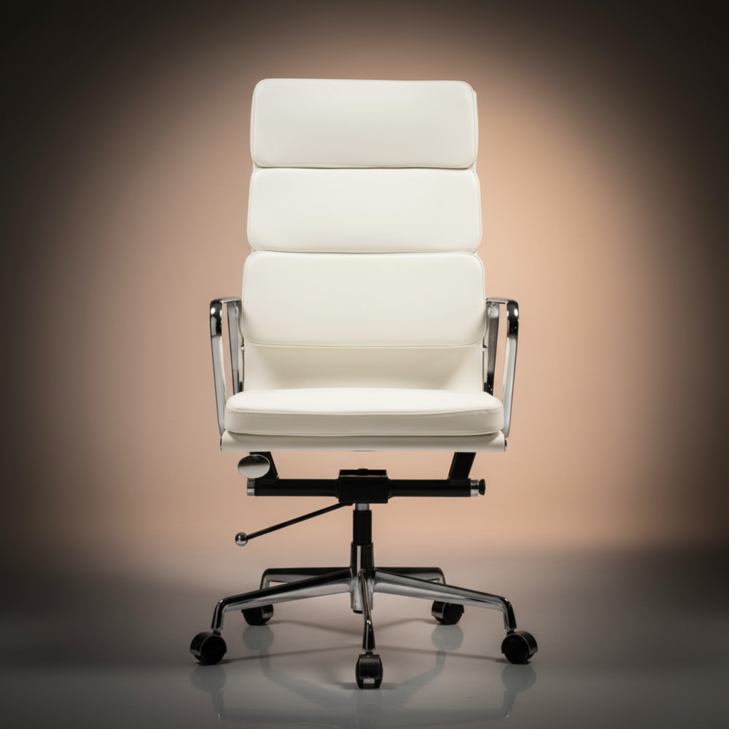 A modern high-back office chair upholstered in white leather or faux leather, featuring a segmented backrest, chrome metal armrests.