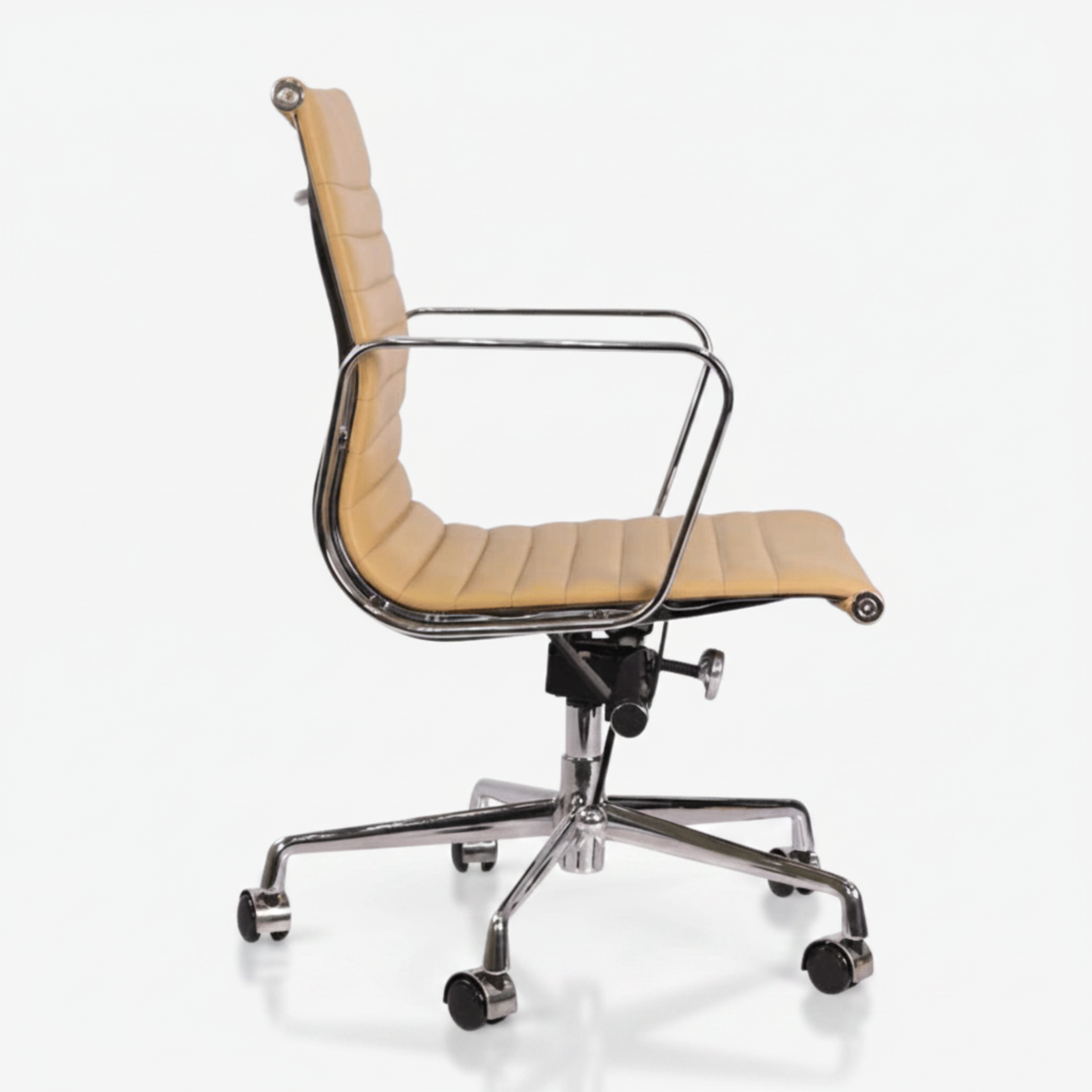 A modern office chair with a curved beige leather seat and backrest, supported by a polished chrome metal.