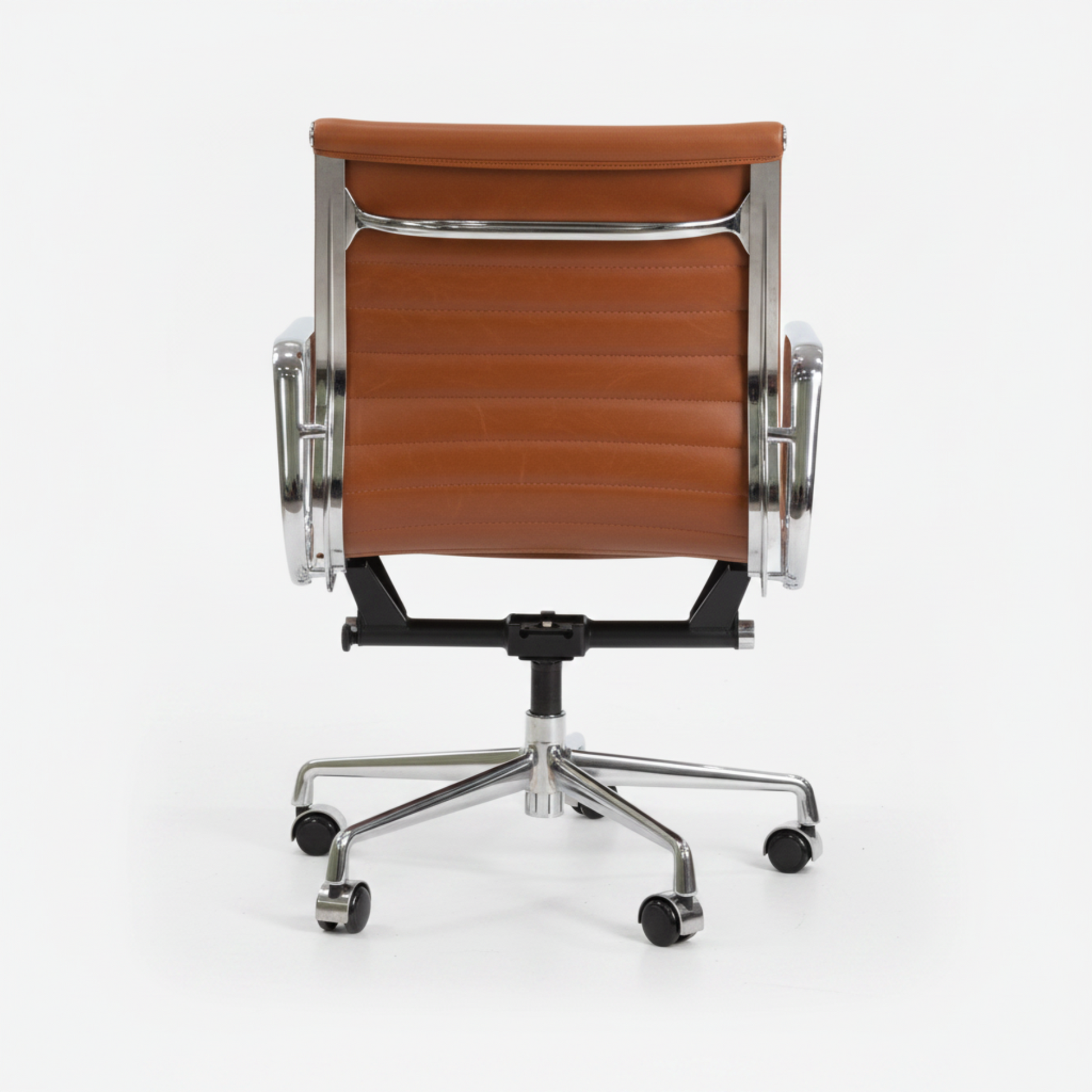 A modern office chair with a brown leather seat and backrest, supported by a polished chrome five-star base.