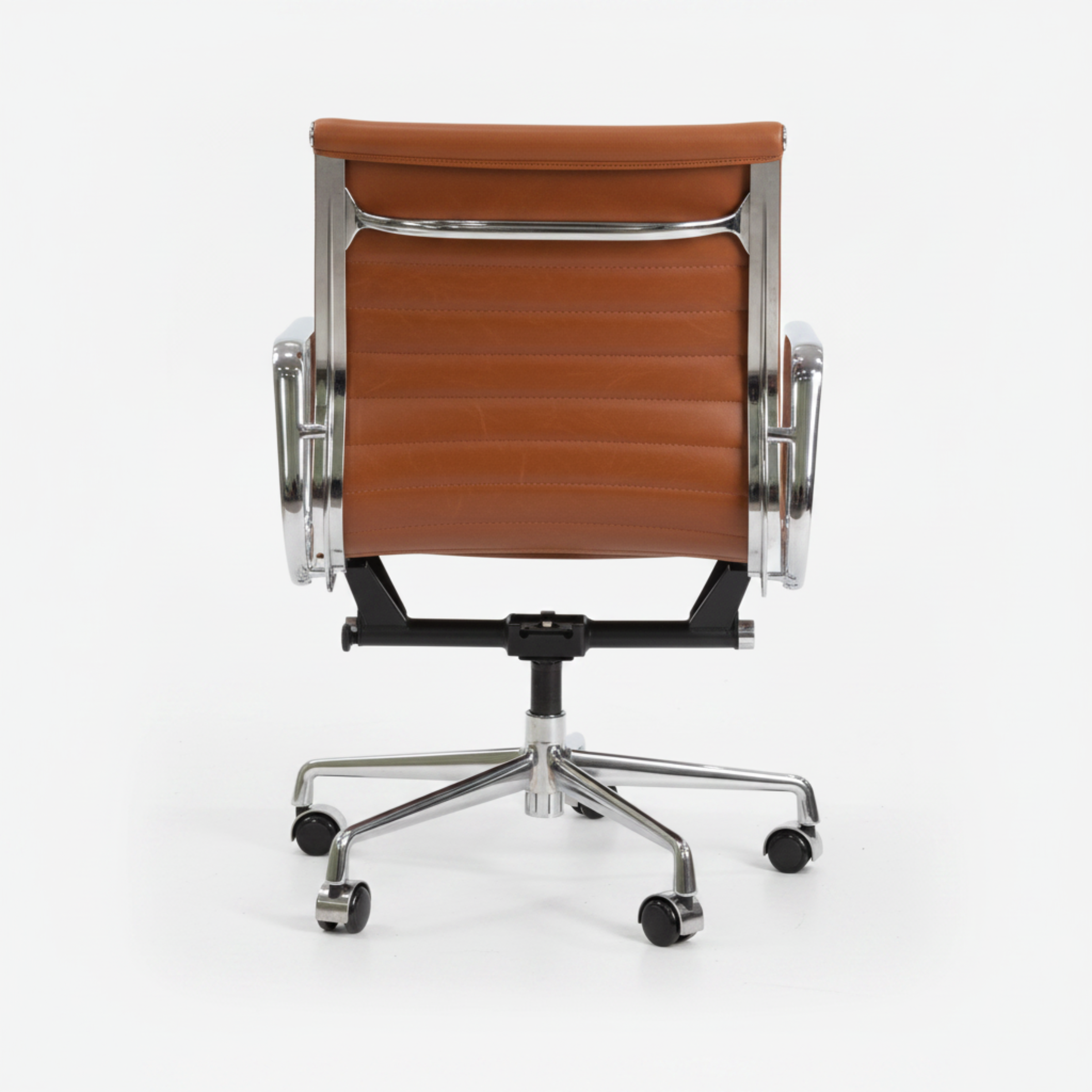 A modern office chair with a brown leather seat and backrest, supported by a polished chrome five-star base.
